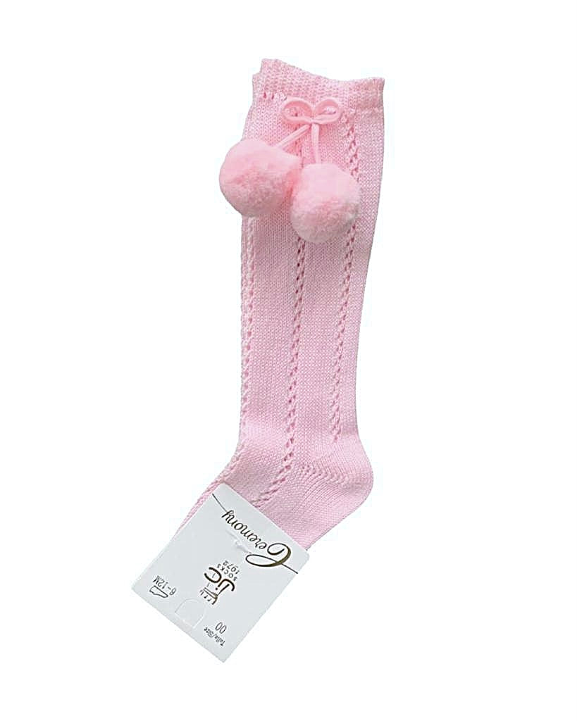 Pink knee high pom pom socks